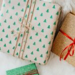 Three festive gift boxes with Christmas-themed wrapping paper, perfect for holiday celebrations.