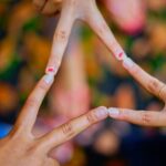 Close-up of hands forming a star shape, symbolizing unity and friendship.